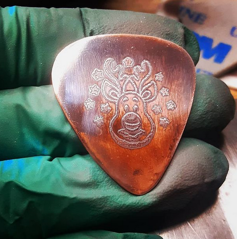 copper guitar pick - playable with rudolph the red nose reindeer
