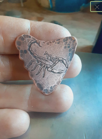 copper shark tooth guitar pick with scorpion - playable