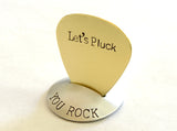 Brass guitar pick with Let’s Pluck