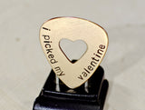 Bronze guitar pick for Valentines Day with a heart and message of love