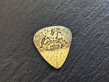 Brass guitar pick with horses , mountains and a hammered texture - playable