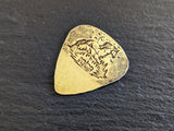 Brass guitar pick with horses , mountains and a hammered texture - playable
