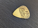 Brass guitar pick with horses , mountains and a hammered texture - playable