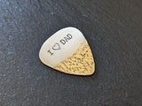 Bronze guitar pick with I ( heart ) dad and a hammered texture - playable