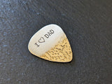 Bronze guitar pick with I ( heart ) dad and a hammered texture - playable