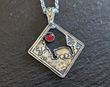 sterling silver bear charm necklace with garnet - bear in forest setting