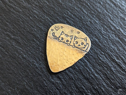 Bronze guitar pick with cute cats