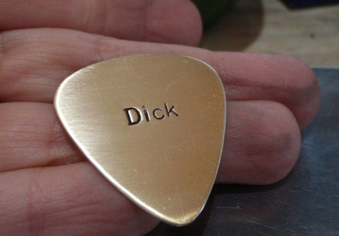 bronze guitar pick - dick pick --- yes I went there