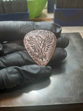 copper guitar pick with Phoenix