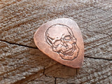handmade copper guitar pick with skull - playable