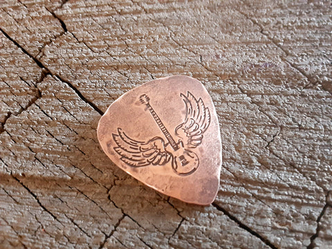 handmade copper guitar pick with winged guitar - playable