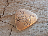 bronze guitar pick with norse runes and sea snakes
