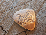 bronze guitar pick with norse runes and sea snakes