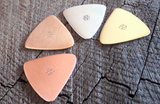 mixed bag of 4 triangular guitar picks in 4 different metals - playable