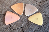 mixed bag of 4 triangular guitar picks in 4 different metals - playable
