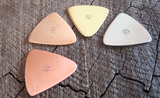 mixed bag of 4 triangular guitar picks in 4 different metals - playable
