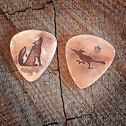 2 playabel copper guitar picks with coyote and roadrunner