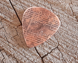 handmade and playable copper pick with music notes