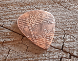 handmade and playable copper pick with music notes