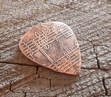 handmade and playable copper pick with music notes