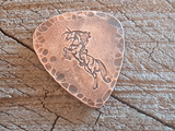 copper guitar pick with unicorn - playable - backside hammered