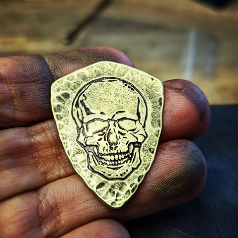 brass shield guitar pick with skull - playable