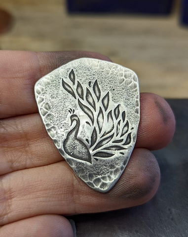 sterling silver shield guitar pick with peacock