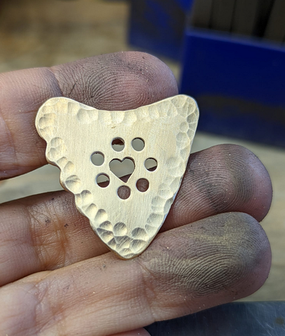 bronze guitar pick - playable - shark tooth shape with heart cut out and holes