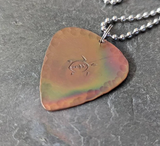 Copper guitar pick necklace with turtle and fire patina