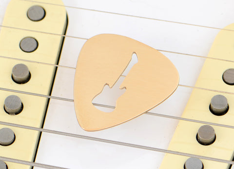 Guitar Pick rocking out a Guitar Cut Out in Bronze