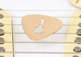 Guitar Pick rocking out a Guitar Cut Out in Bronze