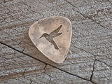 playable bronze guitar pick with hummingbird cut out