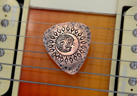 copper guitar pick - playable with sun and moon
