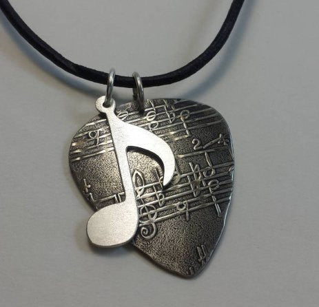 Sterling Silver Guitar Pick necklace with music note charm by NiciLaskin