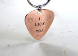 Dog tag in guitar pick shape made from copper