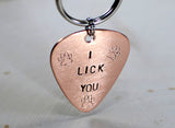 Dog tag in guitar pick shape made from copper