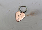 Dog tag in guitar pick shape made from copper