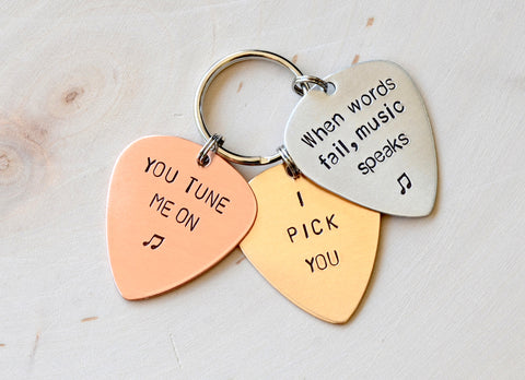 Three metal guitar pick keychain for you to personalize
