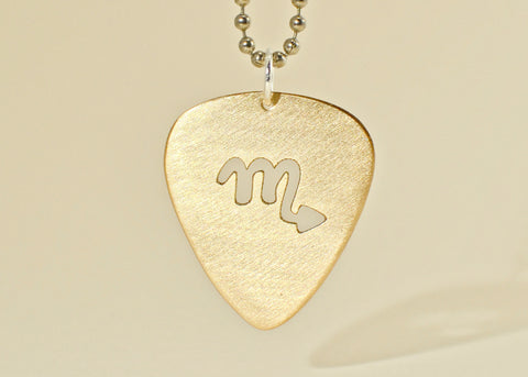 14K gold guitar pick necklace with cut out Zodiac symbol Nici s Picks