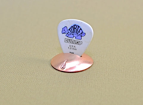 Disc guitar pick stand rocking out in copper