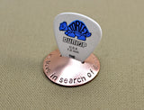 Copper guitar pick stand rocking with music is love in search of a word
