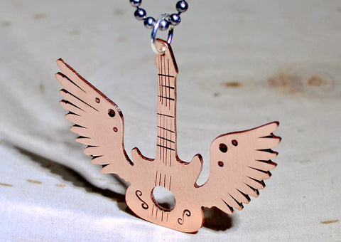 Winged copper guitar necklace with musical inspiration