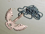 Winged copper guitar necklace with musical inspiration
