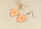 Guitar pick earrings with skulls and crossbones in hammered copper