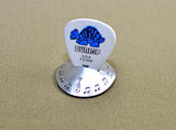 Aluminum guitar pick stand disc shaped with musical inspiration