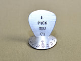 Aluminum guitar pick stand disc shaped with musical inspiration