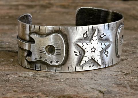 Sterling silver music bracelet with guitars and star for a passionate musician or guitarist