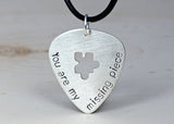 You are my missing piece sterling silver guitar pick necklace with a puzzle cut out