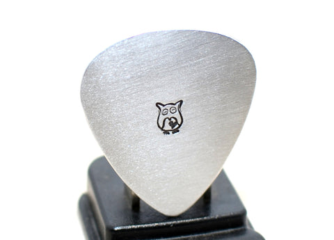 Guitar pick stamped in aluminum with an Owl