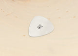 Guitar pick stamped in aluminum with an Owl
